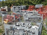 a lot of cages that are sitting in the grass