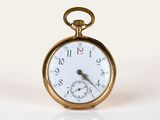 a close up of a pocket watch on a white surface