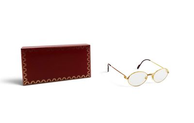 sunglasses in a box and a pair of glasses on a white background