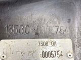 a close up of a metal plate with a number on it
