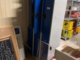 a refrigerator in the middle of a room with a chalk board on the floor