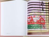 an open book with a picture of a window in it