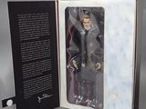 a box with a figure of a man in a suit and tie