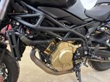 a close up of a motorcycle parked in a garage