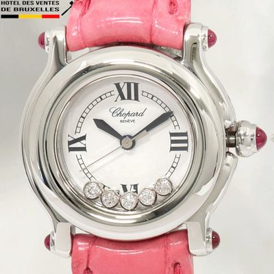 un gros plan d'une montre rose ornée de chiffres romains