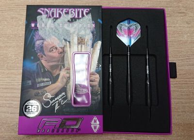 a box with darts and darts in it on a table