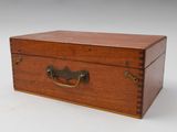 an old wooden box with a handle on a white background