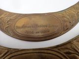 a gold plate with a plaque on it