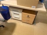 a computer desk with a box on top of it
