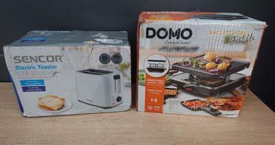 two boxes of food sitting on top of a wooden table next to each other