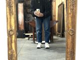 a man taking a picture of himself in a mirror