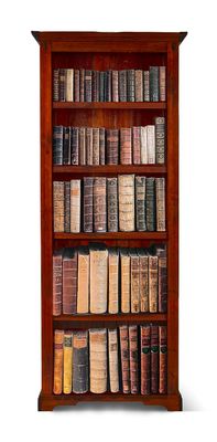 a book shelf with many old books on it