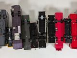 a lot of toy trains that are lined up on the table
