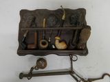 a picture of a wall mounted pipe rack with pipe holders and pipe holders