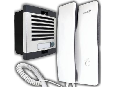 a white and black phone and a white wall mounted air conditioner