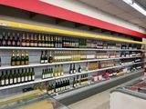 many bottles of wine on the shelves in the store