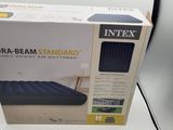 an inflatable air mattress box sitting on top of a white table