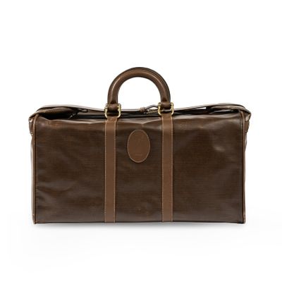 a brown leather duffel bag with two handles and two handles