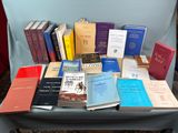 a lot of books that are sitting on a chair