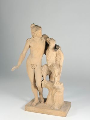 statue of a woman and a bird on a pedestal