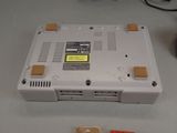 a small white laptop sitting on top of a table