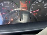 a close up of a car dashboard with a speedometer and gauges