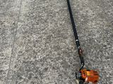 an image of a lawn mower laying on the ground