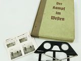 un livre, une paire de ciseaux et une paire de ciseaux posés sur une table