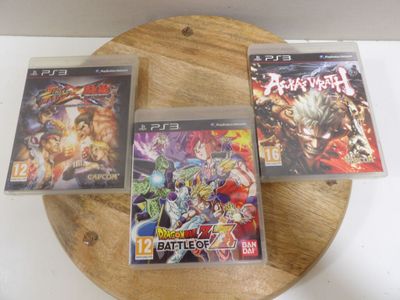 three video games on a wooden tray on a table