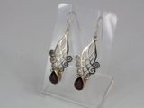 sterling silver and garnetite earrings on clear acrylic stand
