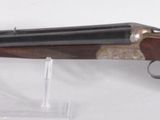 the gun is attached to the wall with a clear plastic holder
