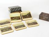 quatre sous-verres et une boîte ornée d'une image représentant un paysage