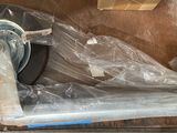 a box with a wheel that is wrapped in plastic