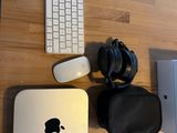 an apple computer sitting on top of a wooden desk next to a keyboard
