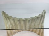 a glass table with a scallop design on it