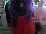 a mannequin with a purple and red dress on it