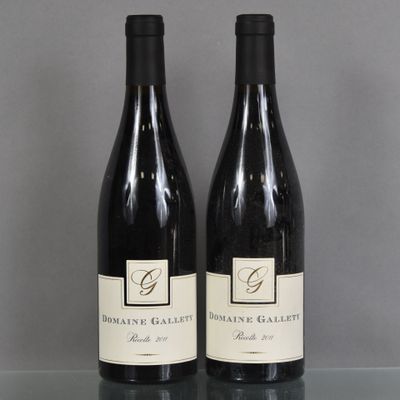two bottles of wine that are sitting on a table