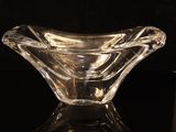 a glass bowl that is sitting on a table