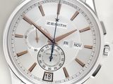 a close up of a wrist watch with a white dial