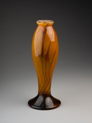 a glass vase that is sitting on a table