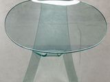 a glass table with a glass top on a white floor
