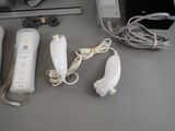 four video game controllers sitting next to each other on a table
