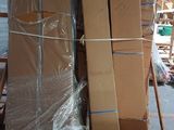 a large pile of boxes on a pallet in a warehouse