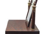 a mirror on a wooden stand with a mirror on it