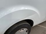 a white car that is parked in a parking lot