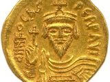une pièce d'or à l'effigie d'un homme coiffé d'une couronne