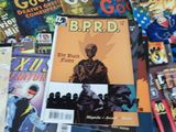 a lot of comic books on the table