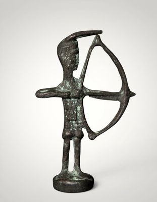 a bronze statue of a man holding a bow and arrow