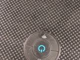 the back of a speaker that is sitting on top of a table