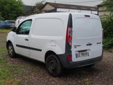 a white van that is parked on the side of the road